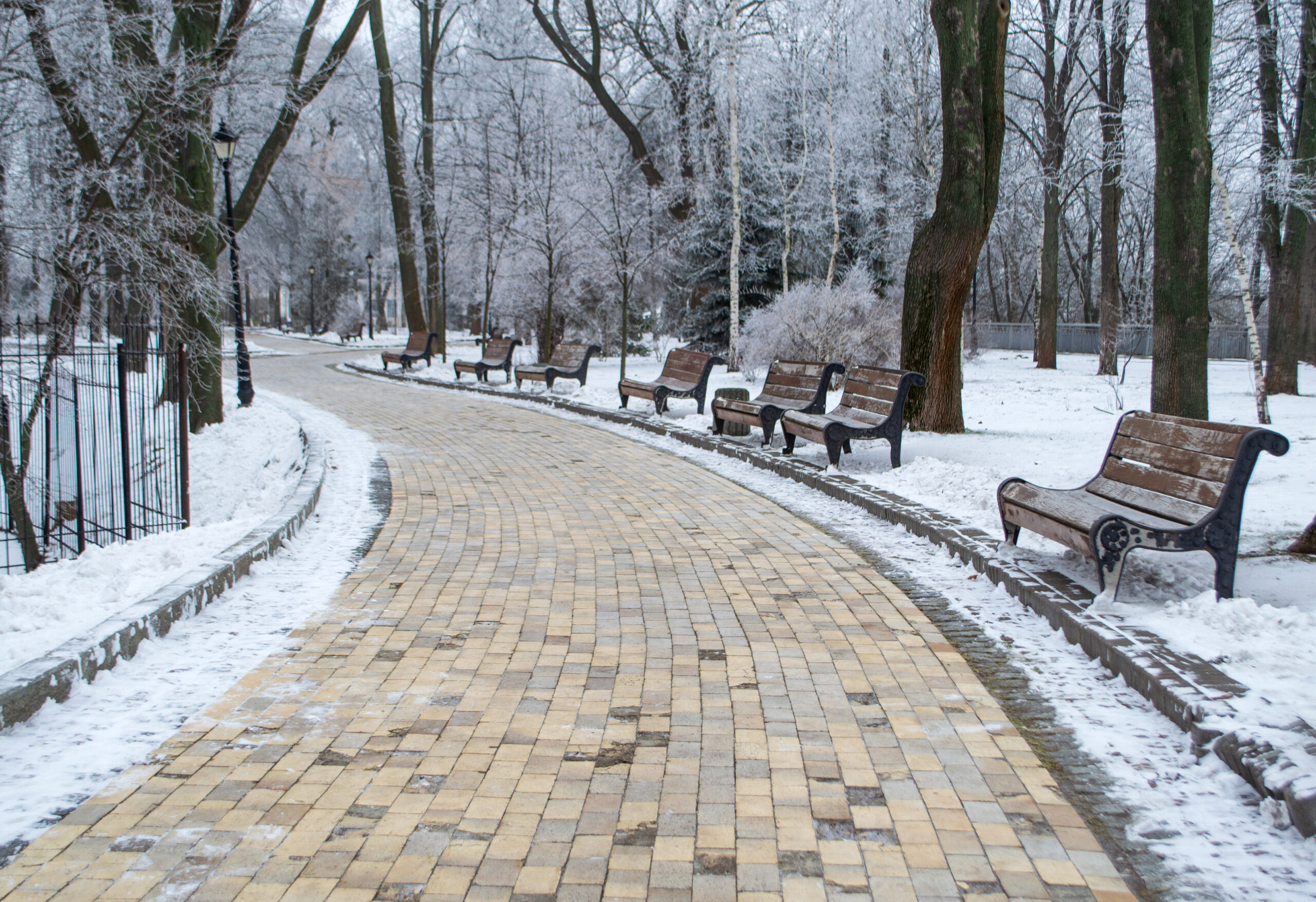Safe Paw and Safe Thaw deicer on stone and mortar walkway in winter